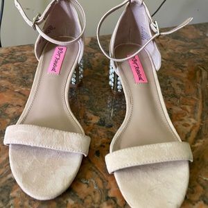 Betsey Johnson pink shoe with pearls on the heels.